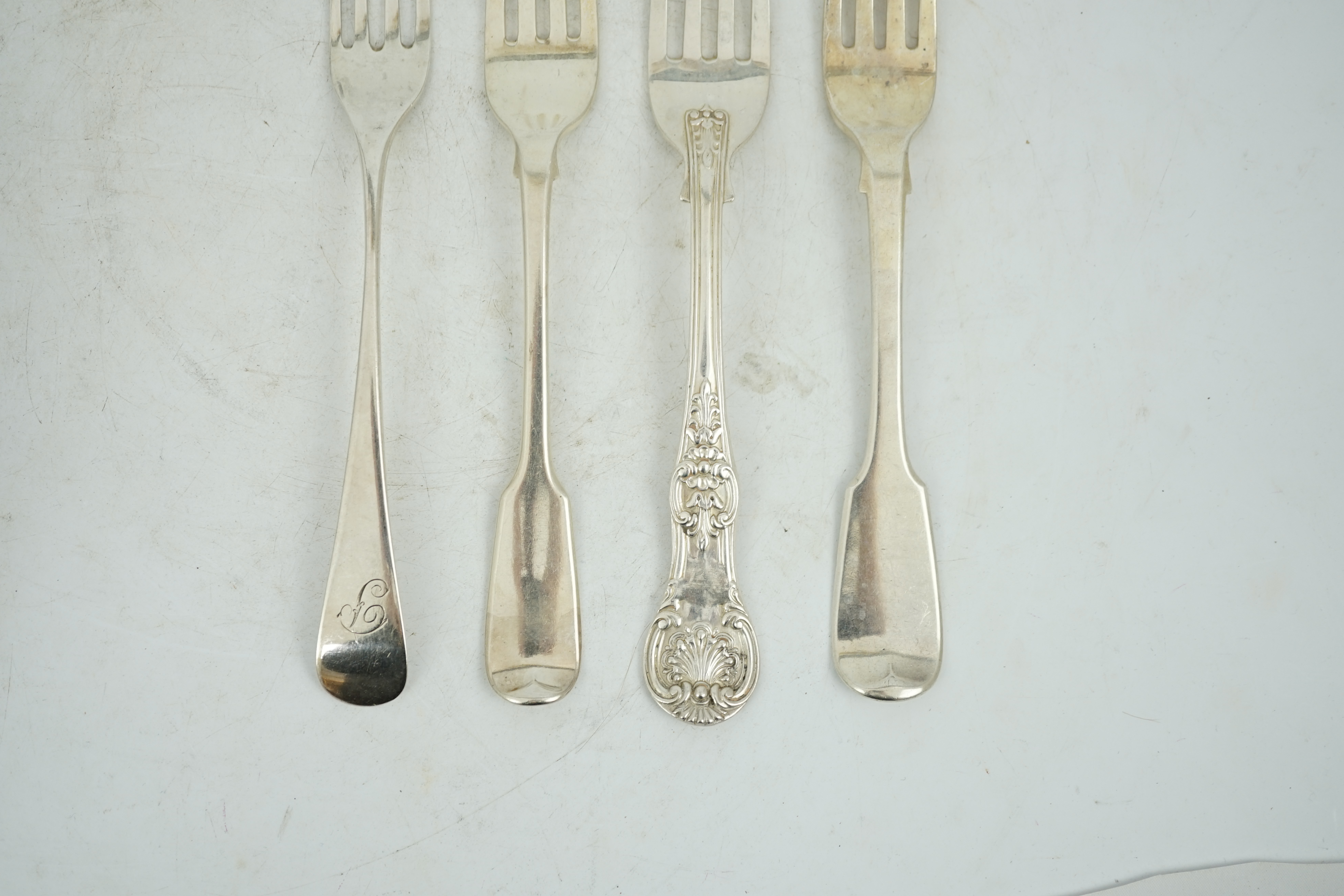 A harlequin collection of 19th century silver Old English pattern table forks, various dates and makers including set of ten by William Ellerby, London, 1804, thirty eight in total, together with sixteen similar fiddle p